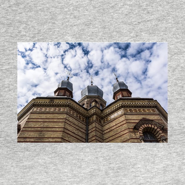 Three domes of Church against cloudy blue sky by lena-maximova